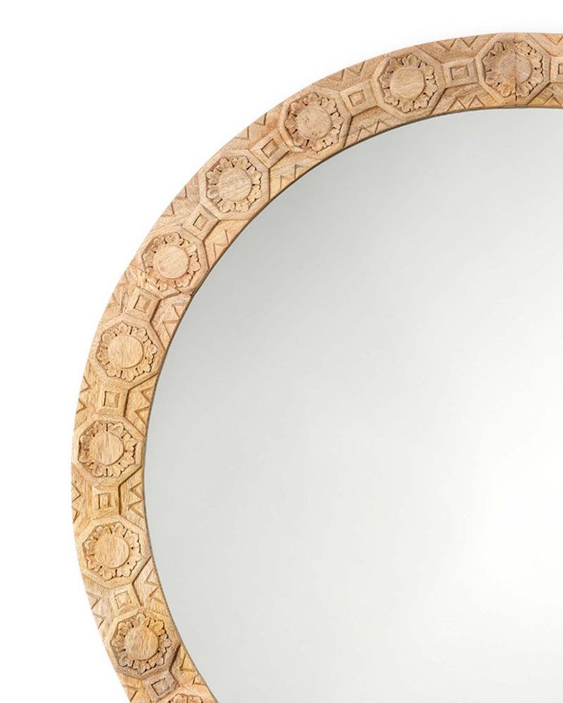 relief carved round mirror