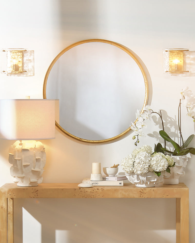 refined round mirror gold leaf