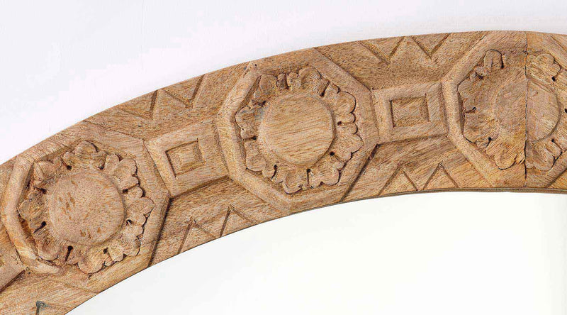 relief carved round mirror