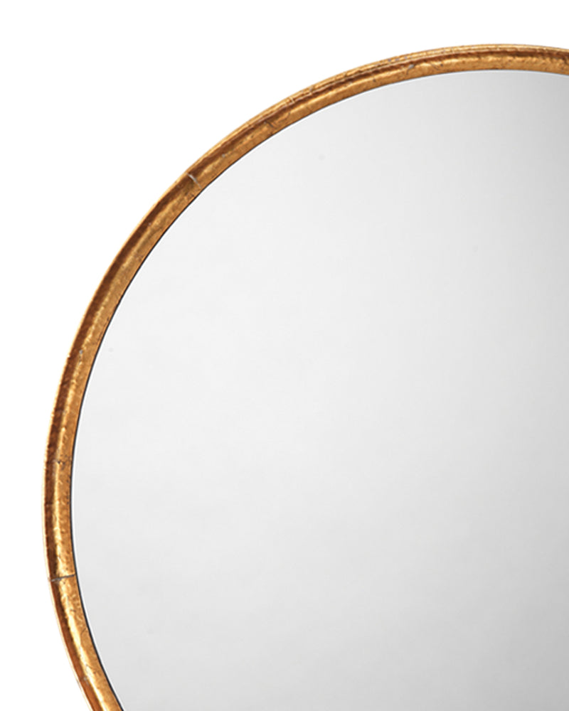 refined round mirror gold leaf